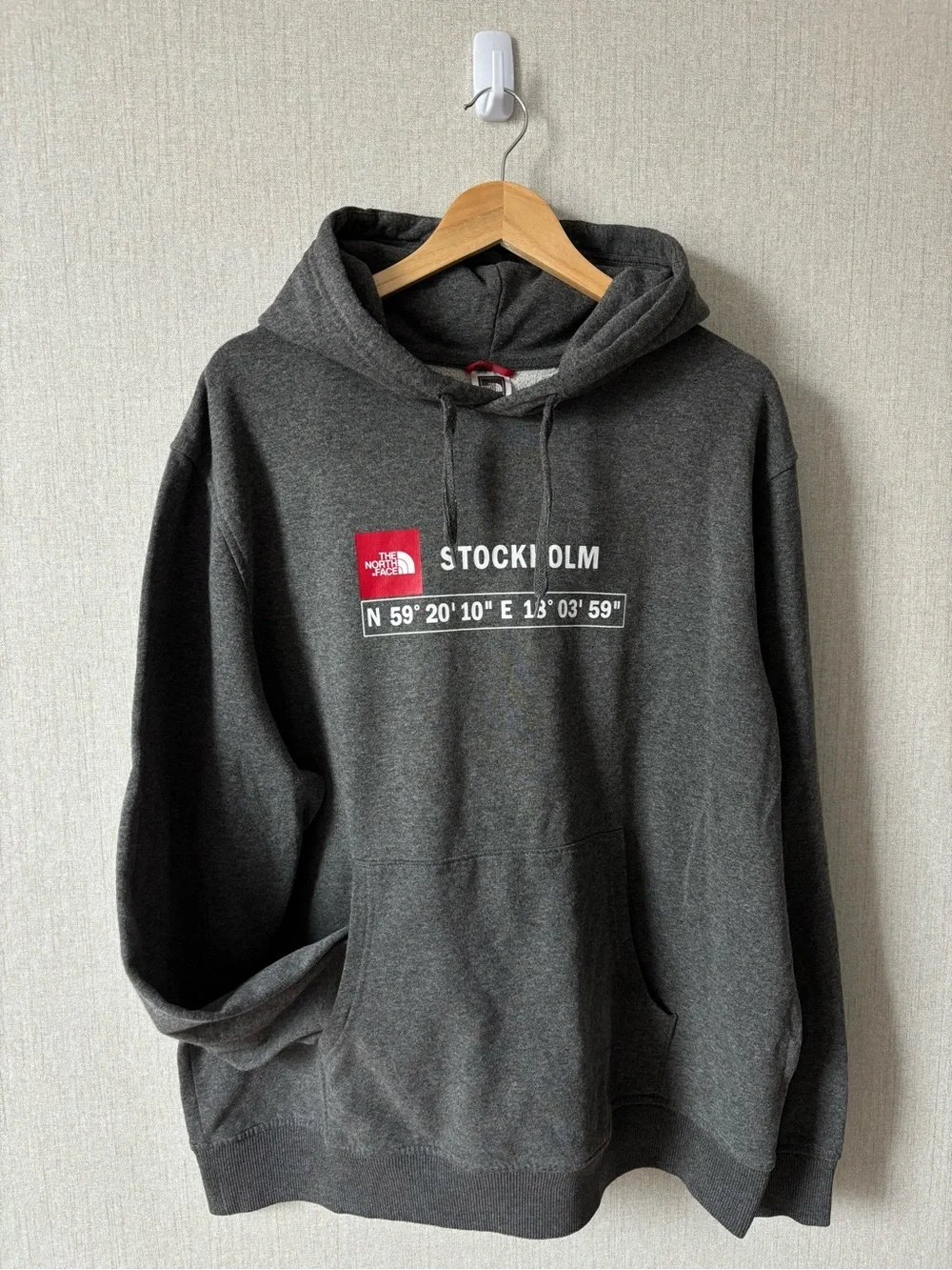 The North Face Men’s Stockholm Hoodie in Charcoal Gray with Red Logo